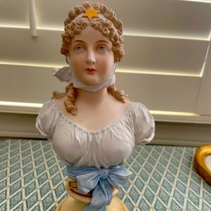 Porcelain girl bust with blue ribbon
